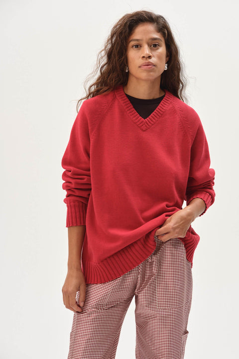 Red cotton knit v neck sweater relaxed fit front view model