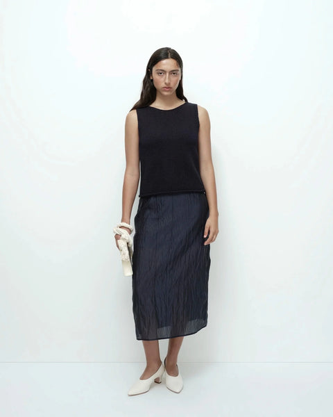 Navy crinkled midi skirt full outfit styled with sleeveless top