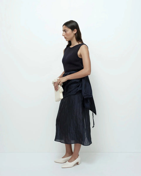 Navy crinkled midi skirt side view lightweight flowy fit