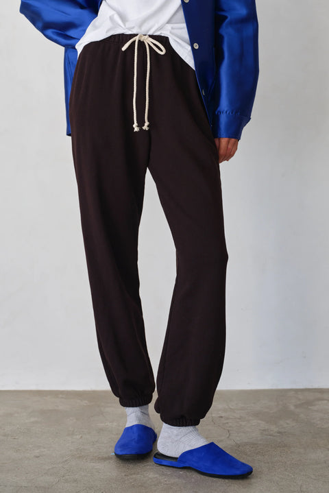 Organic cotton dark brown sweatpants with white tie, drawstring, side pockets, elasticized ankles

