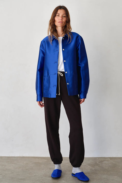 Organic cotton dark brown sweatpants with white tie, drawstring, side pockets, elasticized ankles
