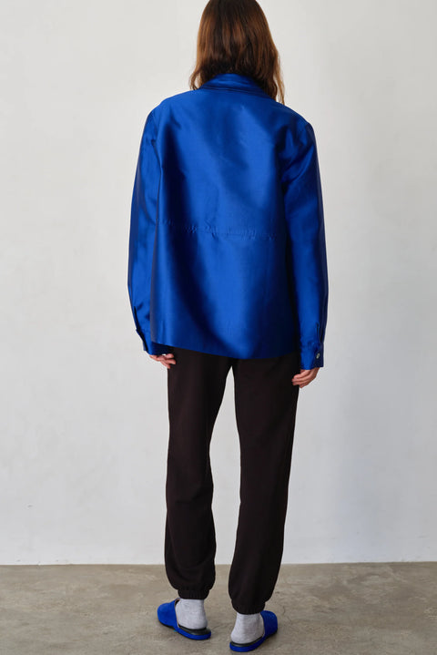 Organic cotton dark brown sweatpants with white tie, drawstring, side pockets, elasticized ankles
