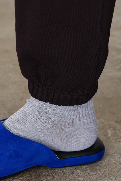 Organic cotton dark brown sweatpants with white tie, drawstring, side pockets, elasticized ankles
