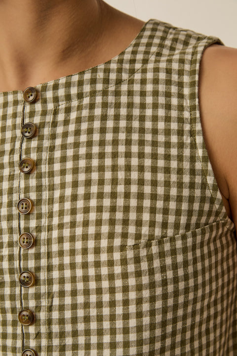 Gingham sleeveless top, retro style, cotton and linen blend, horn-effect buttons and designed to hit at the waist.
