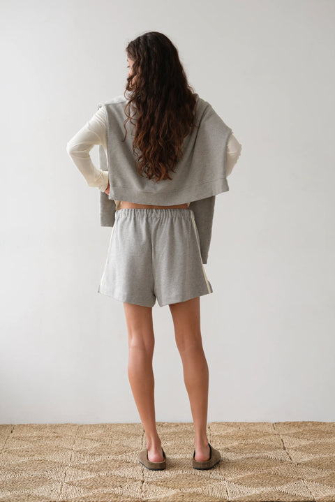 Close-up of double stripe leg detail on DONNI heather grey eco terry shorts – sustainable organic cotton fabric