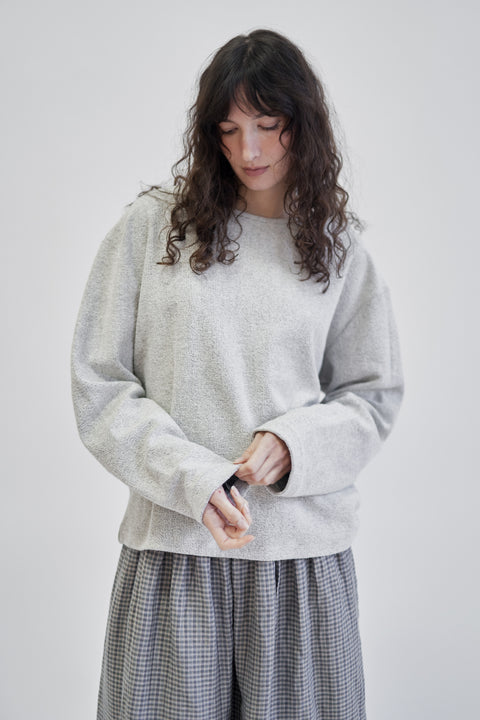 Terry cotton relaxed light grey crew sweater, unisex, relaxed sleeve, drop shoulder, and a clean, almost rolled hem at the neck
