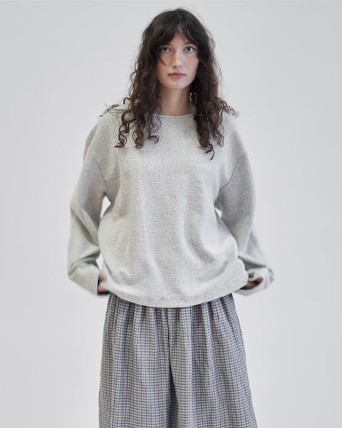 Terry cotton relaxed light grey crew sweater, unisex, relaxed sleeve, drop shoulder, and a clean, almost rolled hem at the neck

