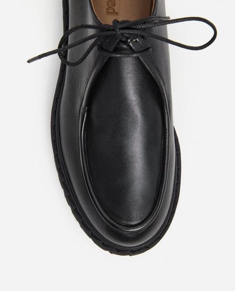Loafer shoe with a lace up design. Made by flattered. Everyday show for men or women. 