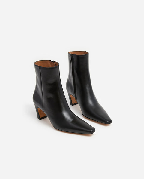 contoured heel, elongated toe, inner zip detailing and made from leather. 2.16” heel, classic shape and look. 
