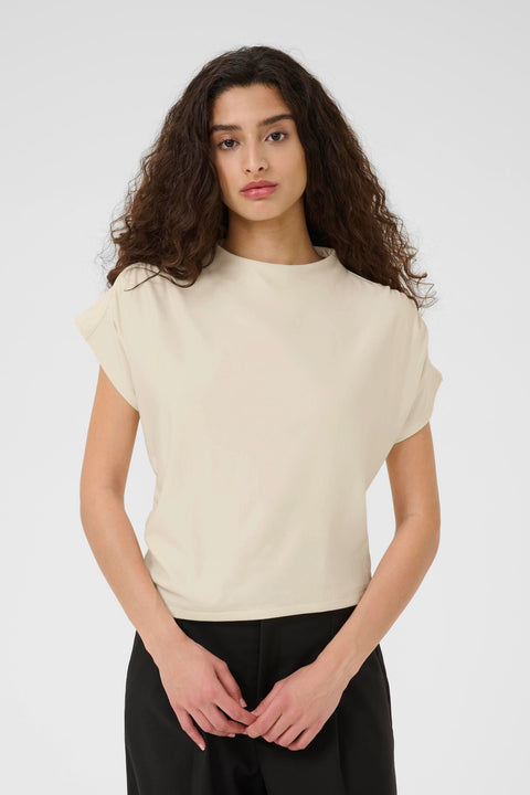 Classic minimalist cream mock neck top with cap sleeves. structured fabric. 
