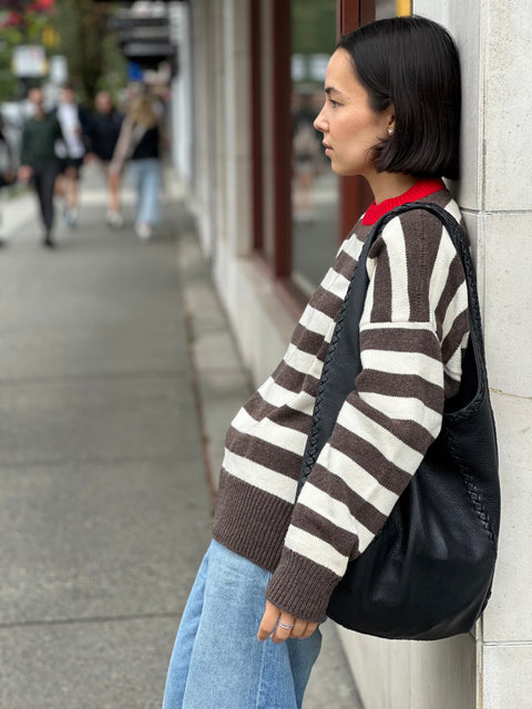 Givéh Stripe Party Sweater – classic stripe knit sweater in 90% wool 10% cashmere with red collar accent, styled on model