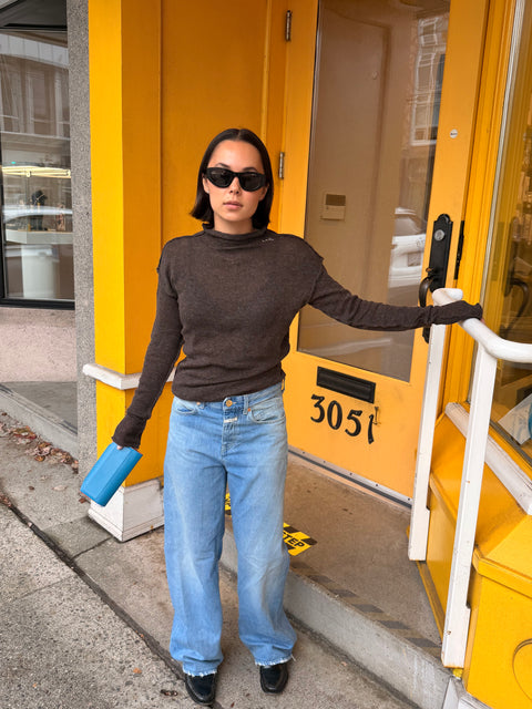 Givéh Coffee Panda Sweater – relaxed fit artisan knit top with reverse seams and long sleeves past hand, side view