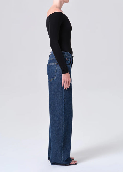 Indigo low curve jeans side view curved outseam wide leg