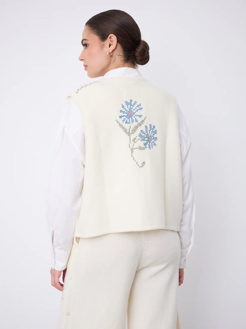 Notshy Lali Vest in Ecru – sleeveless wool and cashmere crochet vest with patchwork knit texture, single button detail and large floral embroidery on the back