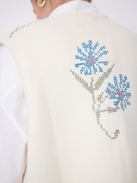 Notshy Lali Vest in Ecru – sleeveless wool and cashmere crochet vest with patchwork knit texture, single button detail and large floral embroidery on the back