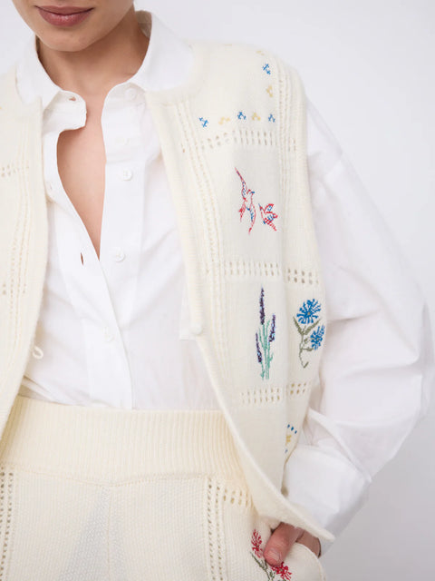 Notshy Lali Vest in Ecru – sleeveless wool and cashmere crochet vest with patchwork knit texture, single button detail and large floral embroidery on the back