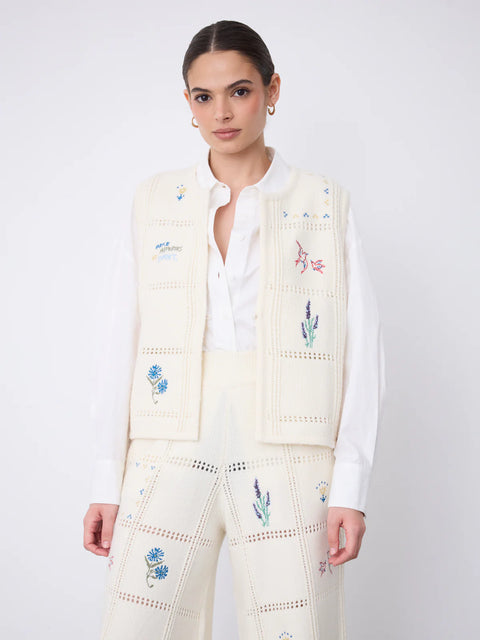 Notshy Lali Vest in Ecru – sleeveless wool and cashmere crochet vest with patchwork knit texture, single button detail and large floral embroidery on the back