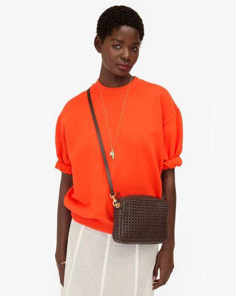 Clare V Midi Sac in chocolate rattan on shoulder – compact day-to-night designer leather crossbody bag