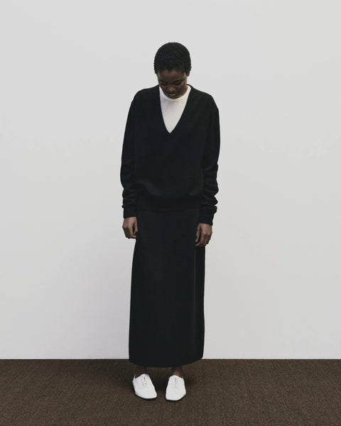 Merino cashmere long skirt in black, elastic waist, back slit, straight fit by Mijeong Park
