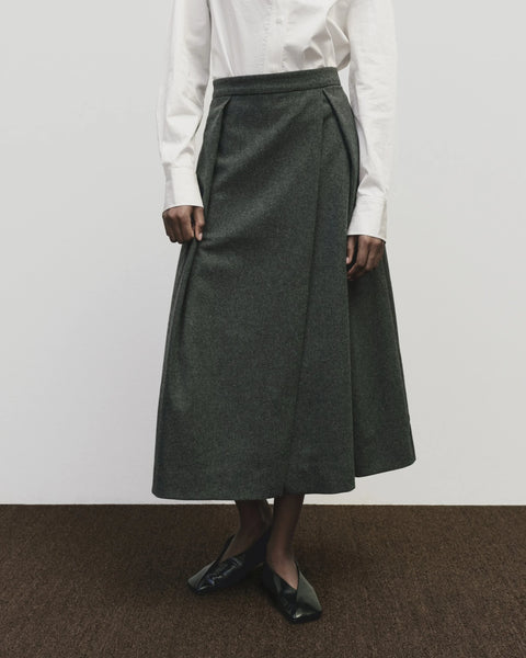 Wool long skirt. Pleated skirt by Mijeong Park. Classic kilt and elongates it to the ankle with an a-line silhouette and pleated, wrap-front detail. Fully lined