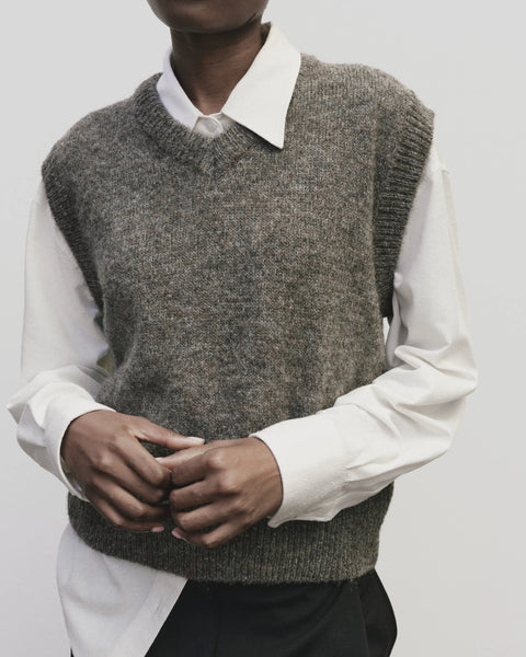 Classic sweater vest, in a relaxed oversized fit, wool blend, V neck with ribbed trims. Mijeong Park Wool Blend V-Neck Vest in Heather Brown
