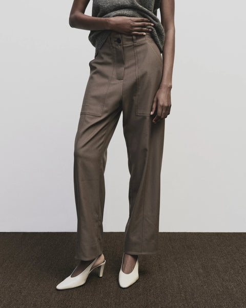 Relaxed fit pants with straight leg and oversized pockets. Buttons on the waist and cuff for adjustability. Trouser by Mijeong Park
