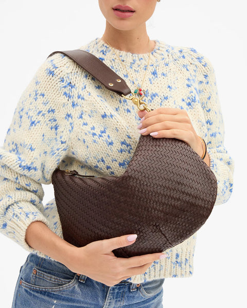 Clare V Chocolate Woven Zig-Zag Moyen Messenger – styled on model with shoulder strap, 15" wide everyday bag
