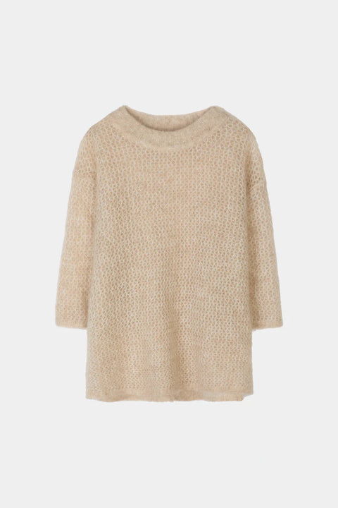 straight silhouette and a refined dropped shoulder, short sleeve sweater, relaxed sleeves finished with a subtle rib and finished with a rounded neckline. Mohair