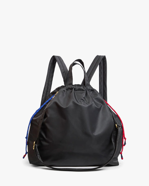 Clare V Sac Tout Backpack in Black - Styled Shot Worn as Crossbody Showing Versatile Strap Configuration