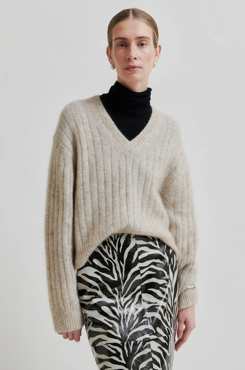 Mohair and wool blend sweater, soft and stretchy, classic fit relaxed with a wide rib fabric. V neck long sleeve sweater in beige. Second female brand. 