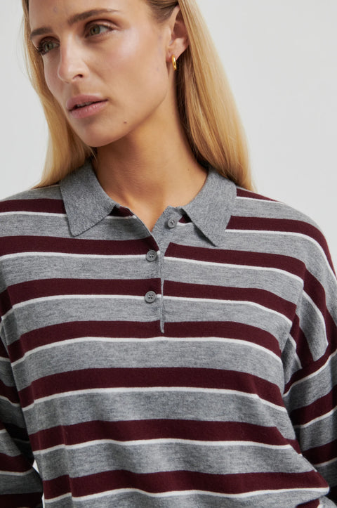 Classic rugby shirt, with boxy stripe grey and brown. Merino blend with a polo collar, half-button placket, and ribbing at the collar, cuffs, and hem. Cut short but not cropped, in a slightly relaxed fit.
