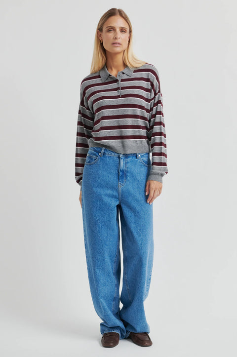 Classic rugby shirt, with boxy stripe grey and brown. Merino blend with a polo collar, half-button placket, and ribbing at the collar, cuffs, and hem. Cut short but not cropped, in a slightly relaxed fit.
