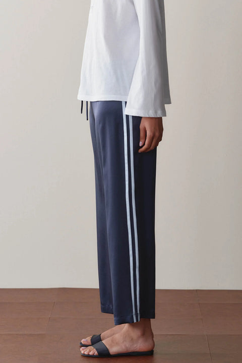 DONNI Silk Stripe Crop Pant Navy Cloud - Front View Showing Navy and Cloud White Racer Stripe and Fluid Silk Drape