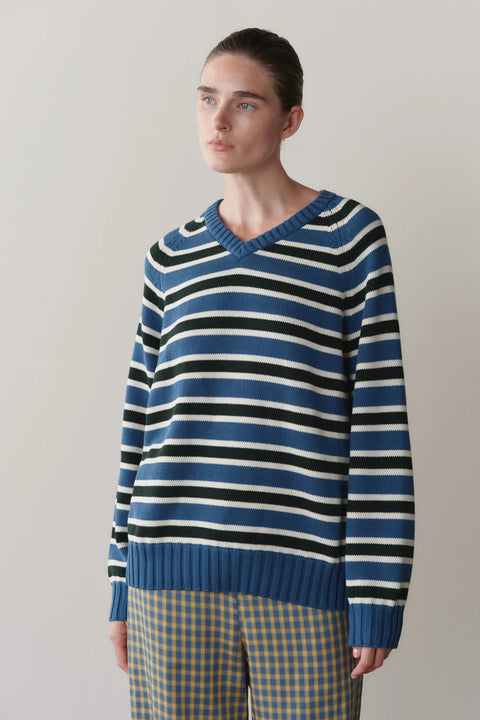 DONNI Cotton Knit Stripe V Neck Sweater - Side View Highlighting Relaxed Silhouette in Lake Blue, Creme and Fir Stripe