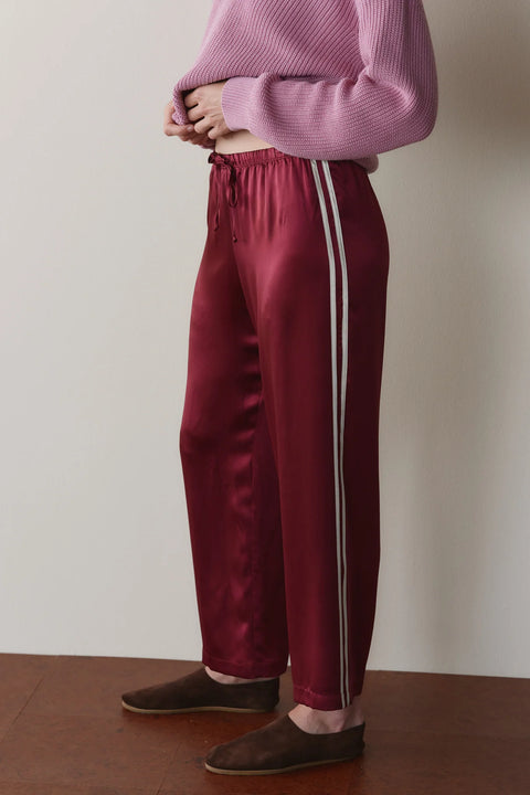 DONNI The Silk Stripe Crop Pant in Oxblood - Styled Shot Showing Burgundy Silk Pant for an Elevated Evening Look