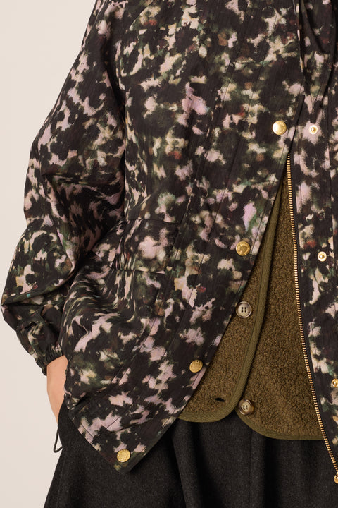Des Petits Hauts Ylang Windbreaker in Camo - Lifestyle Shot of Women's French Brand Camouflage Jacket