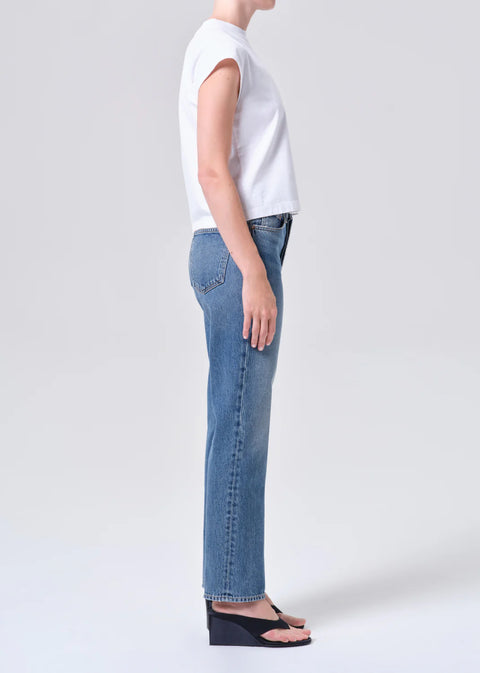 AGOLDE Lana relaxed straight leg jean in Liberty, a medium tinted indigo wash crafted from non-stretch regenerative cotton denim.