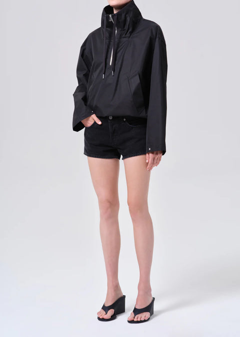 AGOLDE Lydia anorak in black, featuring a three-quarter zip, high collar, and a relaxed cropped fit in breathable lightweight nylon.