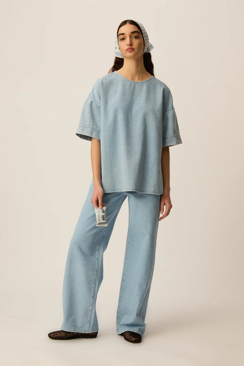 Des Petits Hauts Loris oversized denim t-shirt in bleached blue cotton with a relaxed fit and shirttail hem.
