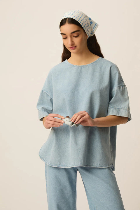Des Petits Hauts Loris oversized denim t-shirt in bleached blue cotton with a relaxed fit and shirttail hem.