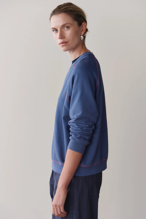 DONNI Eco Terry Contrast Stitch Sweatshirt in Lapis and Raspberry – cozy sustainable crew neck sweatshirt for women