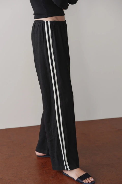 DONNI The Linen Crop Racer Stripe Pant in Jet Black – wide-leg cropped 100% linen pants with racer stripes and elasticated waistband, made in Los Angeles