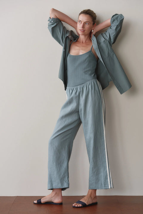DONNI Sage Green linen stripe pant styled as a resort and transitional season outfit – loose fit women's trousers